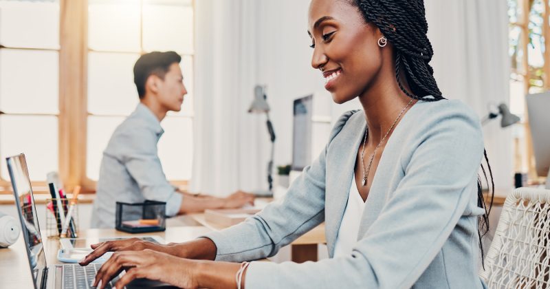 Finance black woman, office and laptop typing corporate business financial accounting online profit