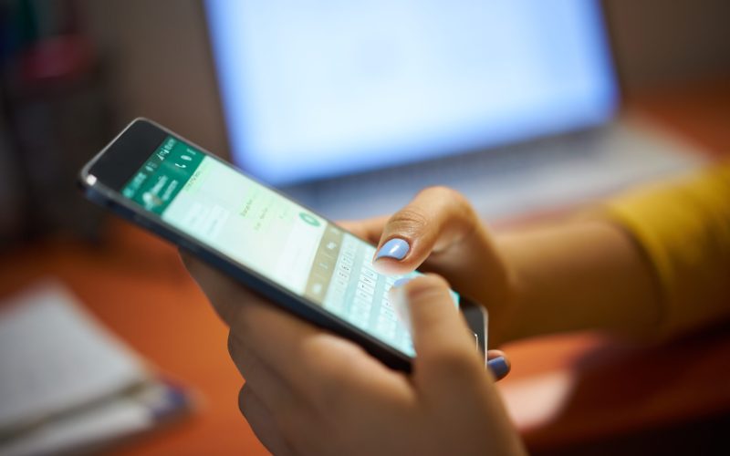 Girl Typing Phone Message
