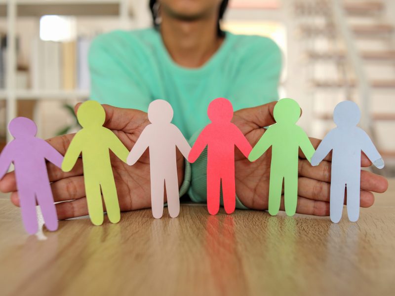 person-holding-hands-with-paper-people-in-support-2026-03-24-07-42-03-utc